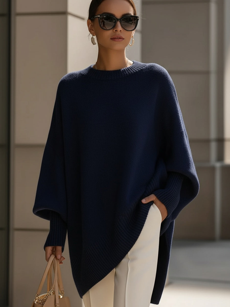 Pull beige Claudia de Danoir Paris, élégant et polyvalent, porté sur un mannequin avec col en V et manches longues.