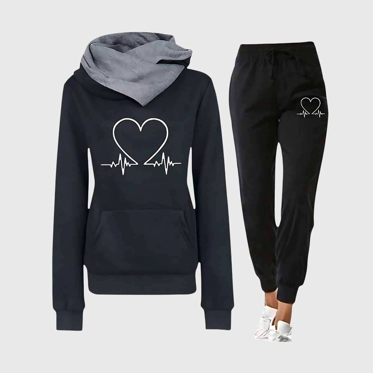 Ensemble sport élégant Hilary de Danoir Paris, veste rose et pantalon sains, pour un look chic et décontracté.