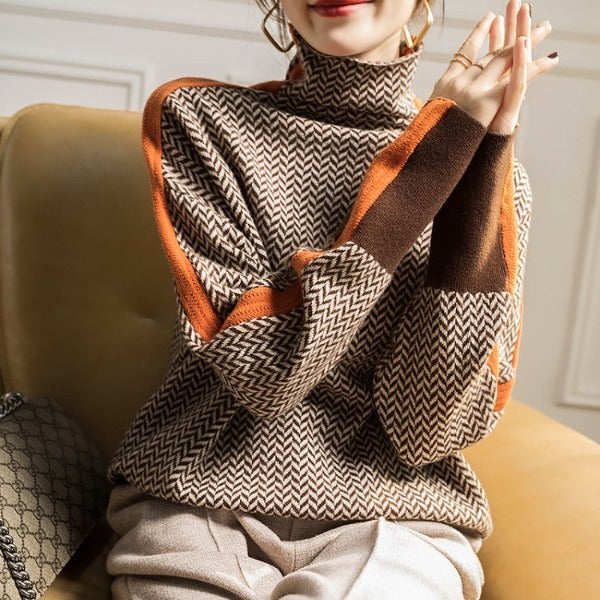 Pull roulé orange Sylvie de Danoir Paris, élégant et confortable, porté en style décontracté.