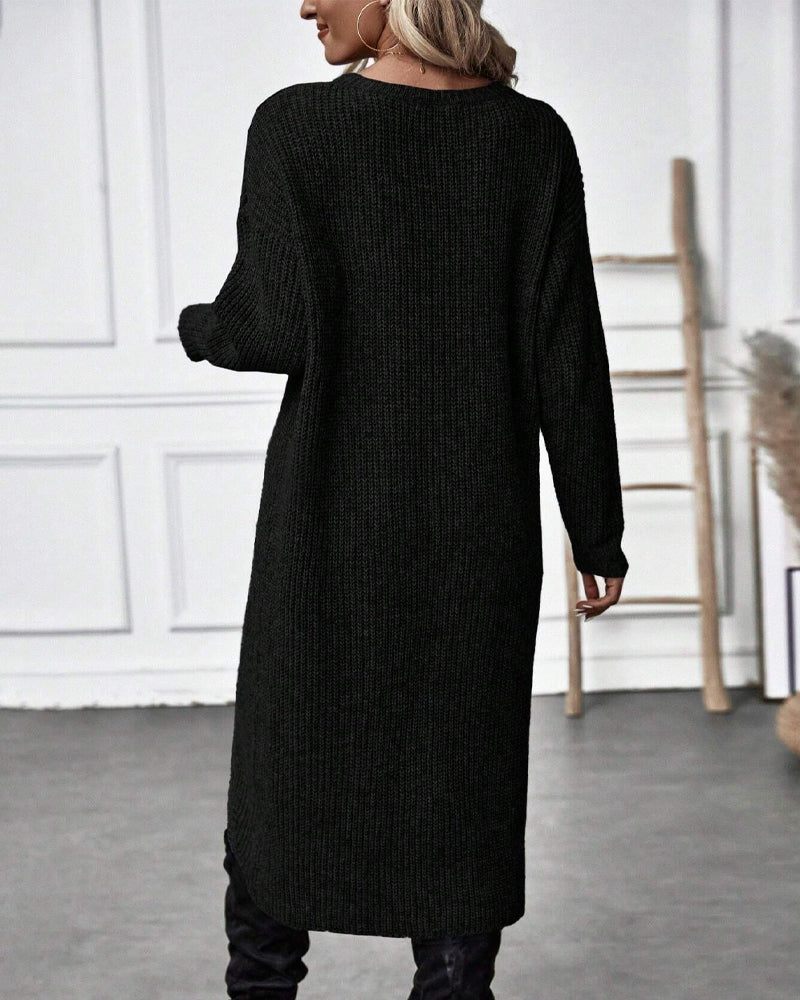 Pull long élégant Brigit de Danoir Paris, en gris, avec coupe fluide et détails sophistiqués, porté sur un mannequin.