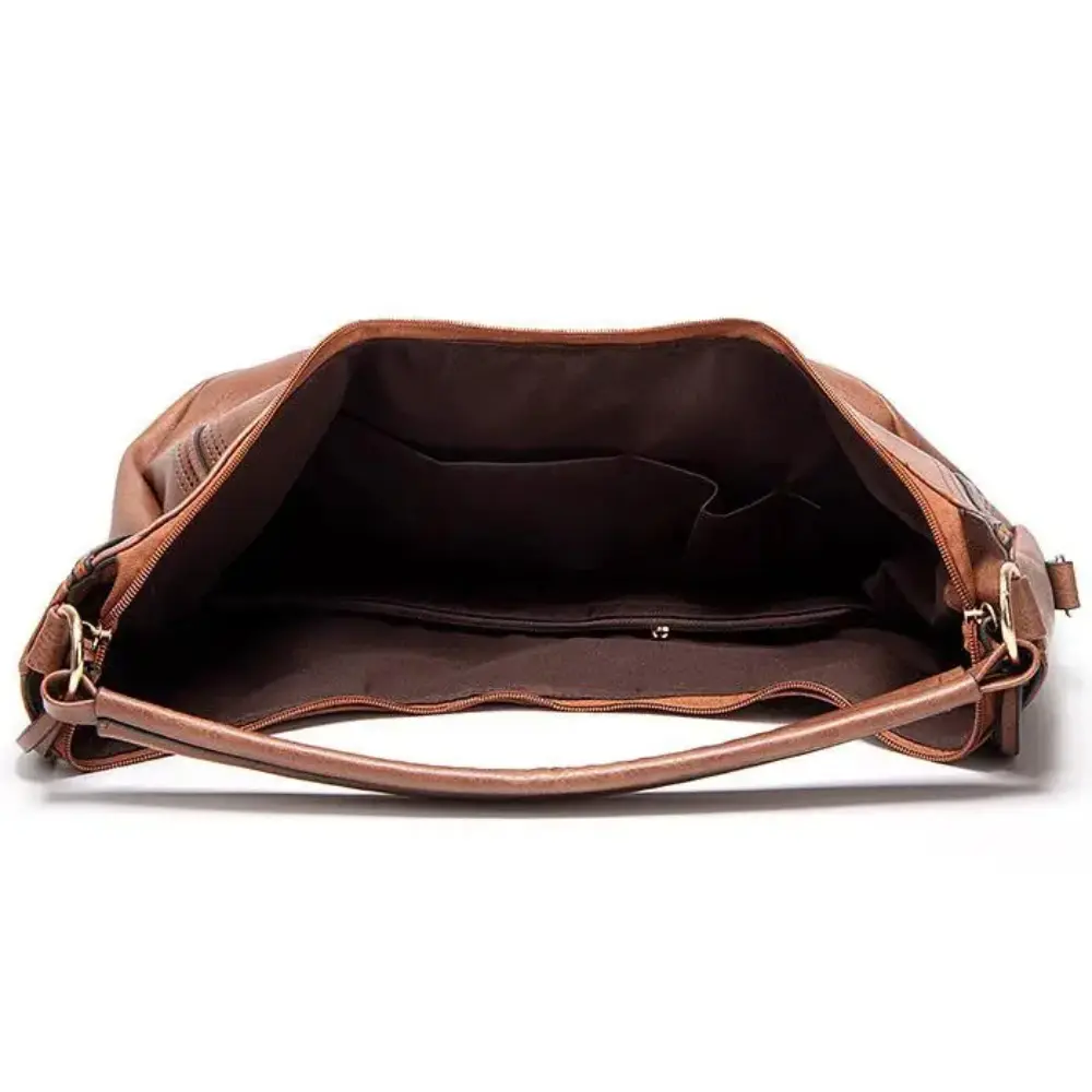 Sac vintage intemporel et polyvalent Anya de Danoir Paris, en gris, avec poignées en cuir et design élégant pour femmes.
