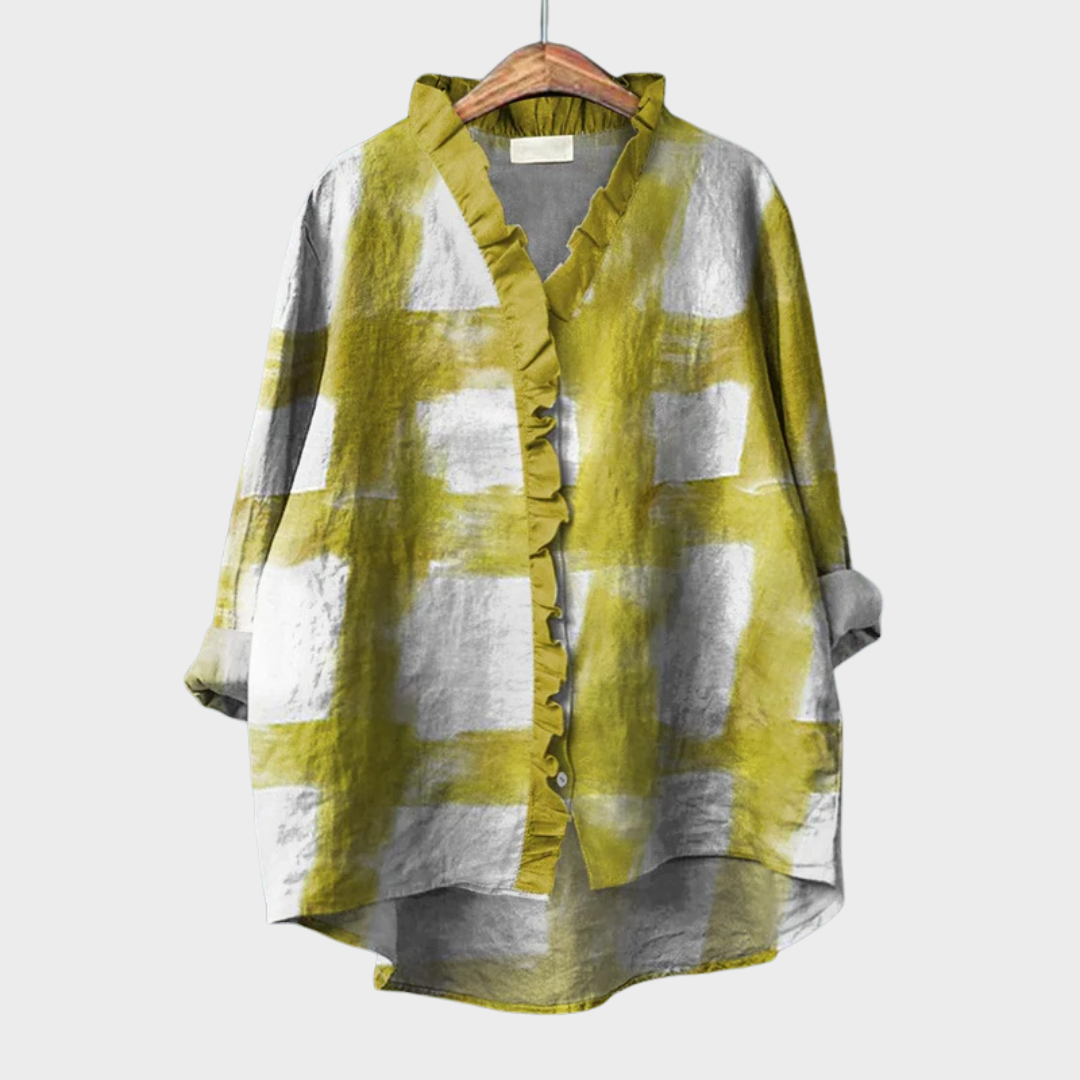 Blouse graphique chic Melissa de Danoir Paris en tissu jaune avec motif élégant, vue de face sur mannequin.