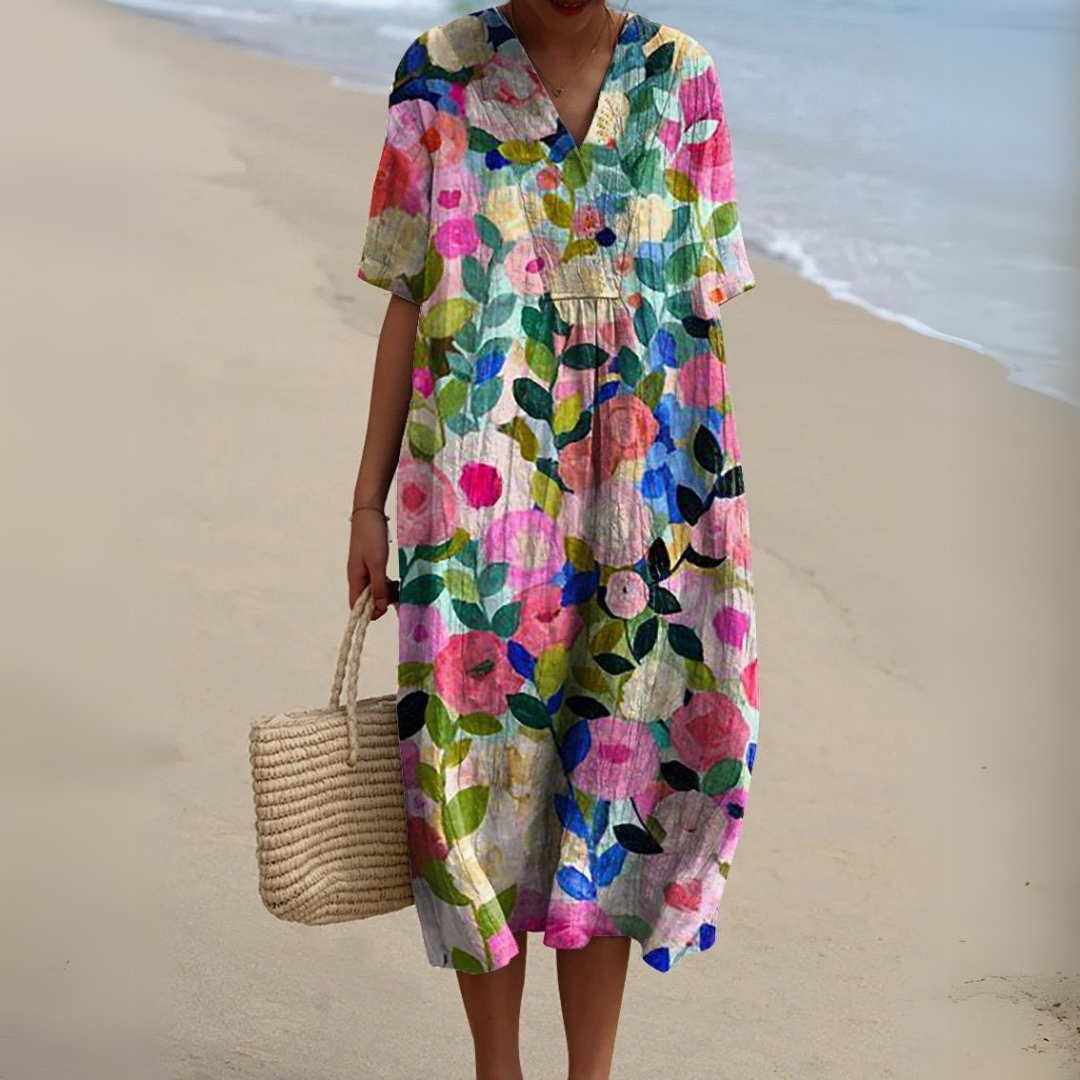 Robe fleurie élégante Nathalie de Danoir Paris, jupe fluide avec motif floral, parfaite pour une occasion chic.
