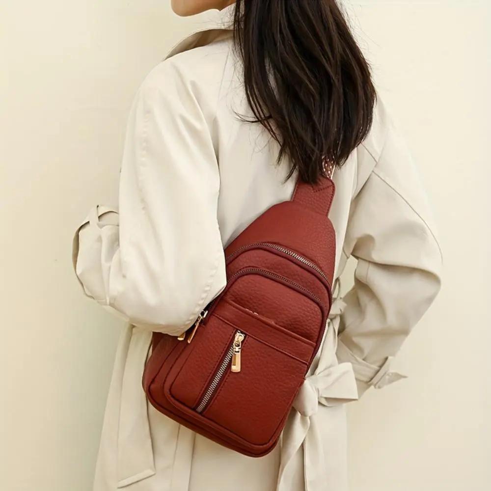 Sac à bandoulière Fiona de Danoir Paris en kaki avec roulettes, design pratique et élégant pour voyager et transporter facilement.