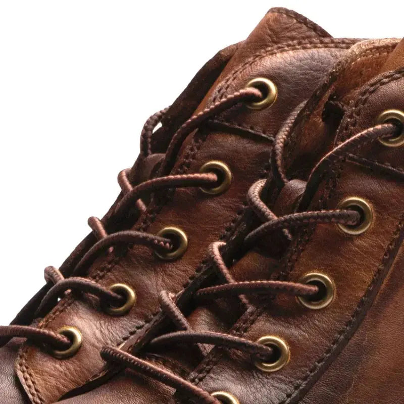 Bottes en cuir marron Hunter™ pour homme de Danoir Paris, style élégant et robuste, visibles en image.