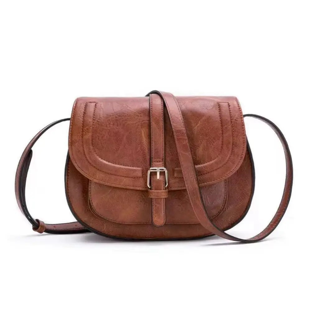 Sac à main Sienna Danoir Paris en cuir marron foncé, élégant et intemporel, avec poignées et fermeture métallique visible.