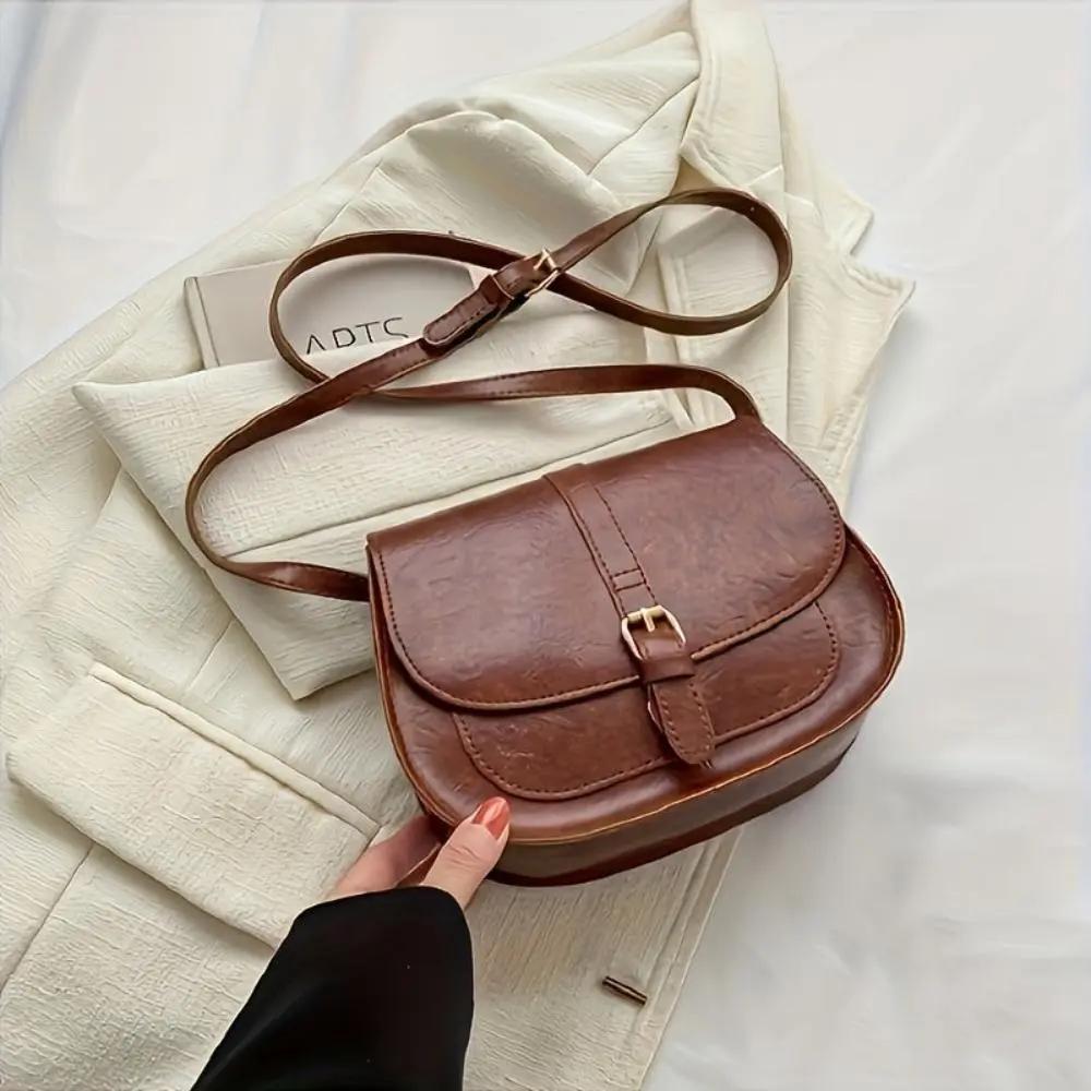 Sac à main marron foncé Danoir Paris Sienna, sac à main intemporel en cuir avec poignées et fermeture élégante.