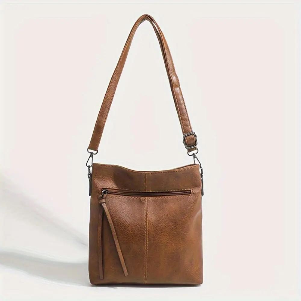 Sac à bandoulière vintage Danoir Paris Lina avec motif échiquier marron, en cuir élégant et style rétro.