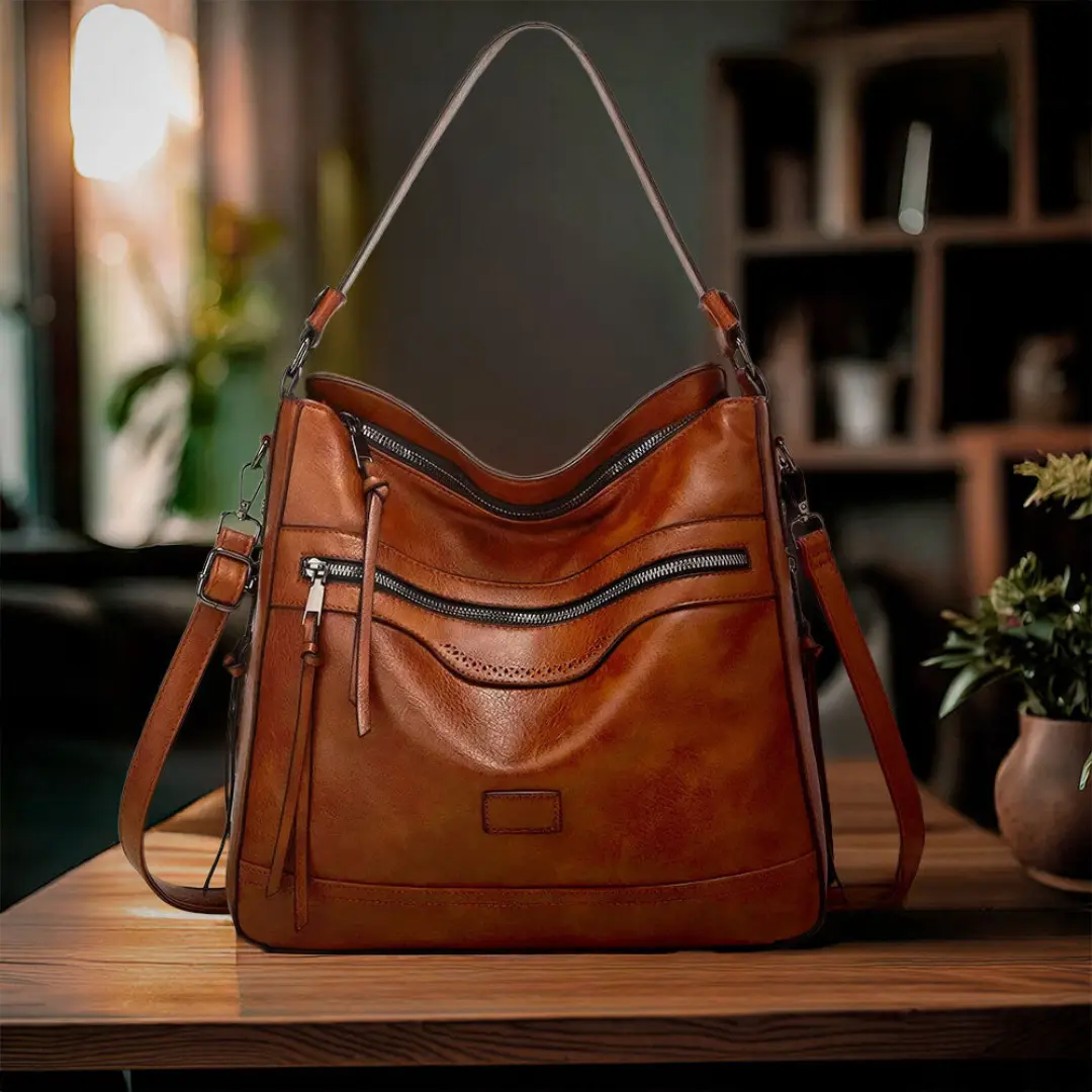 Sacoche rétro Muriel de Danoir Paris en marron, élégante et vintage, avec détails en cuir et bandoulière ajustable.