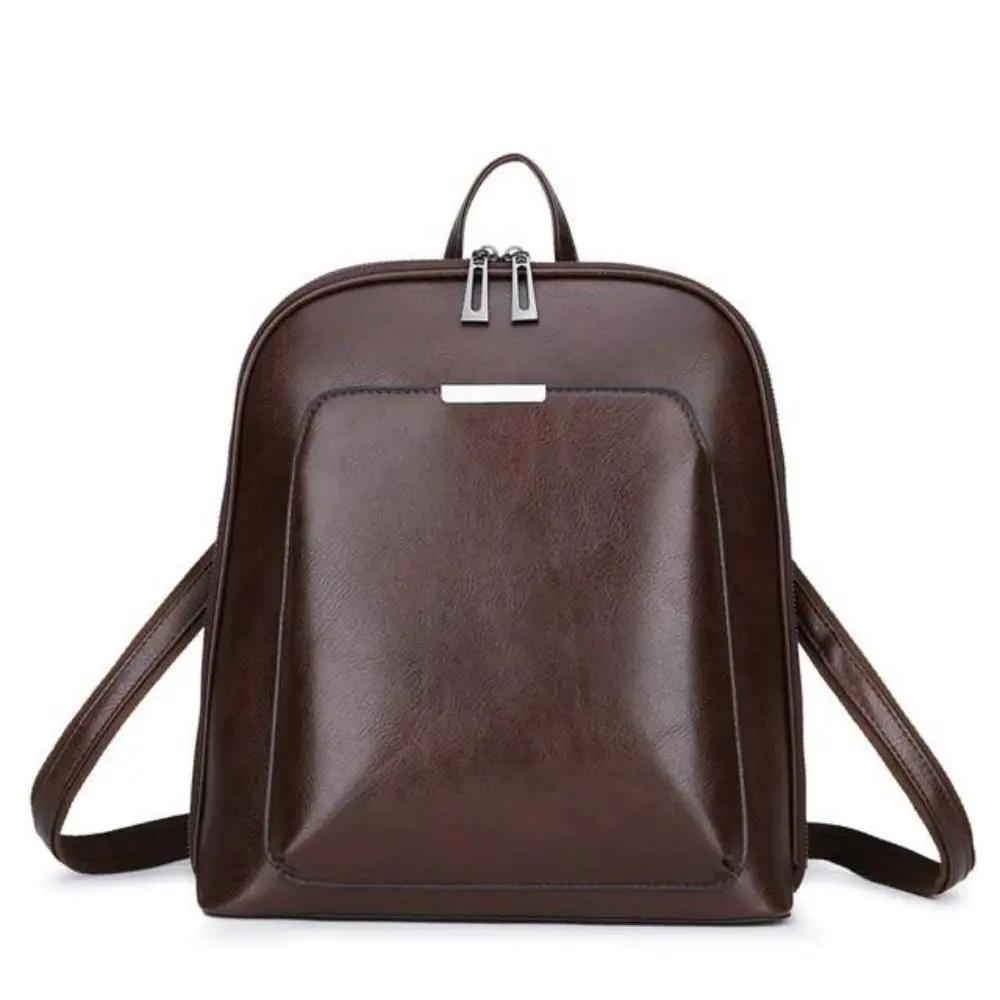 Sac à deux zips Naomi de Danoir Paris, en cuir marron, élégance simple et design intemporel, vue de face sur fond blanc.