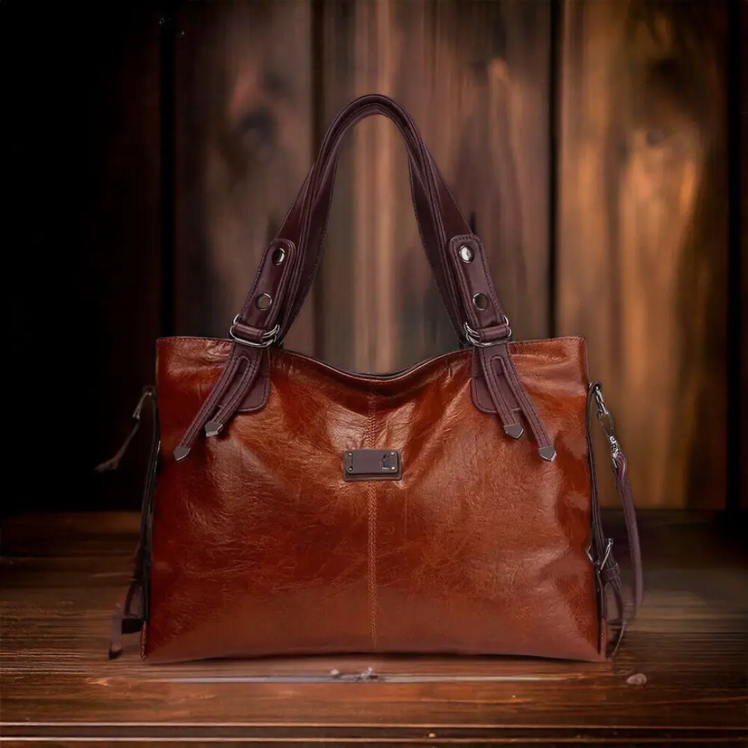 Sac de voyage Sienna de Danoir Paris, sac de voyage marron avec poignées en cuir et design intemporel élégant.