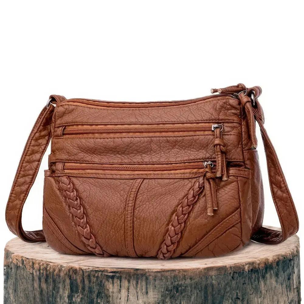 Sac à main marron Talia de Danoir Paris, sac d'élégance intemporelle avec poignées et finition sophistiquée.