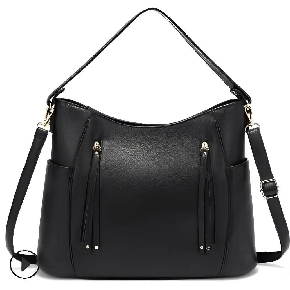Sac à bandoulière vintage Tessa de Danoir Paris en marron avec design classique et intemporel, en cuir élégant.