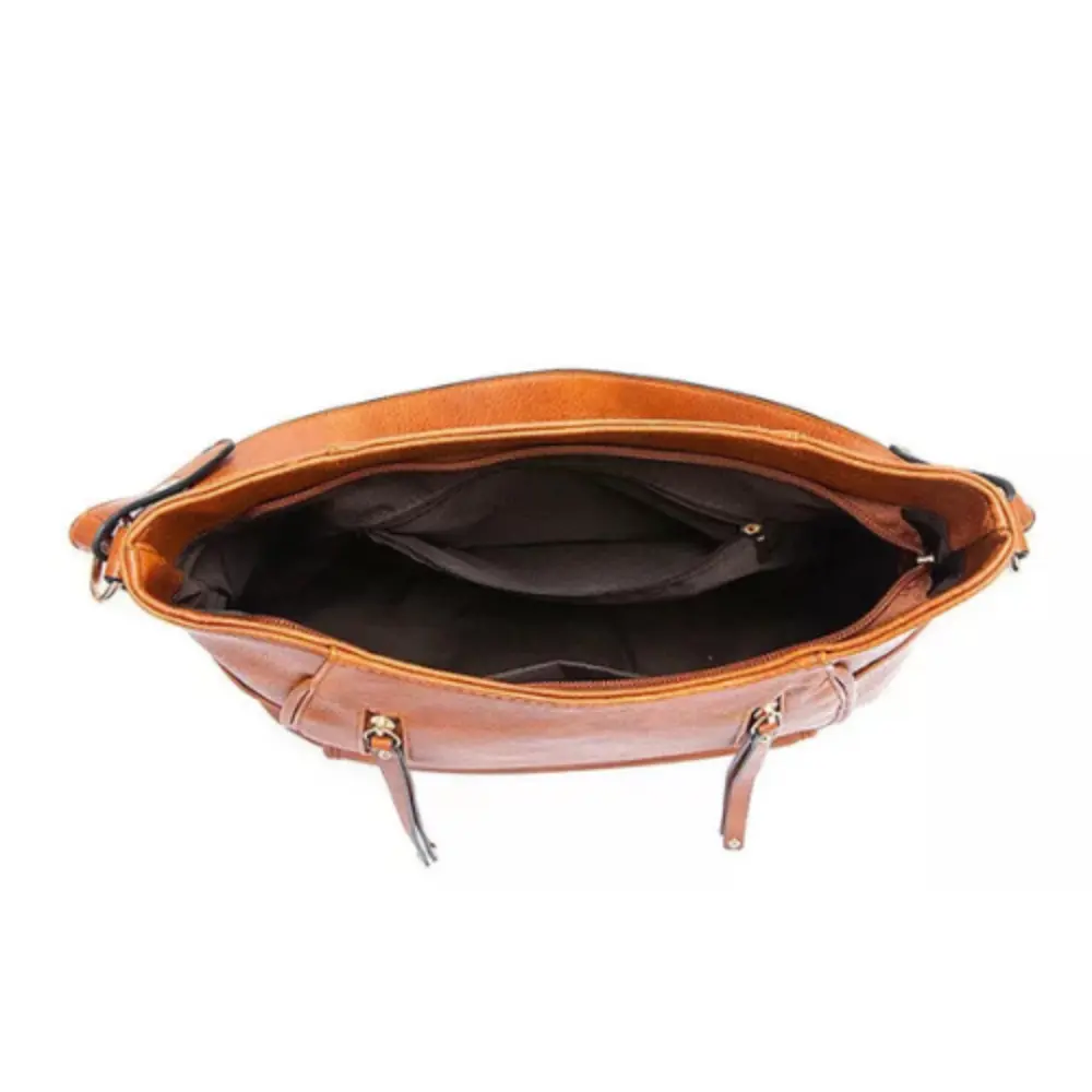 Sac à bandoulière vintage Tessa de Danoir Paris, en cuir marron, design classique et intemporel, visible avec détails élégants.