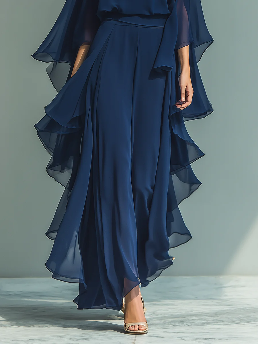 Ensemble assorti Aurora Danoir Paris en chiffon élégant avec volants, comprenant un haut et un pantalon bleu pastel.