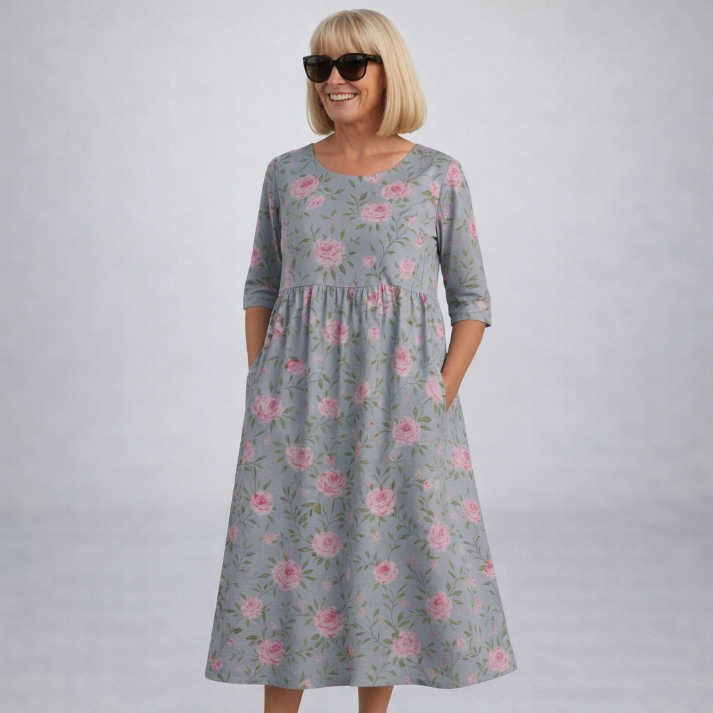 Robe midi fleurie Danoir Paris Brittany avec poches, tissu bleu marine, manches courtes, style élégant et décontracté.