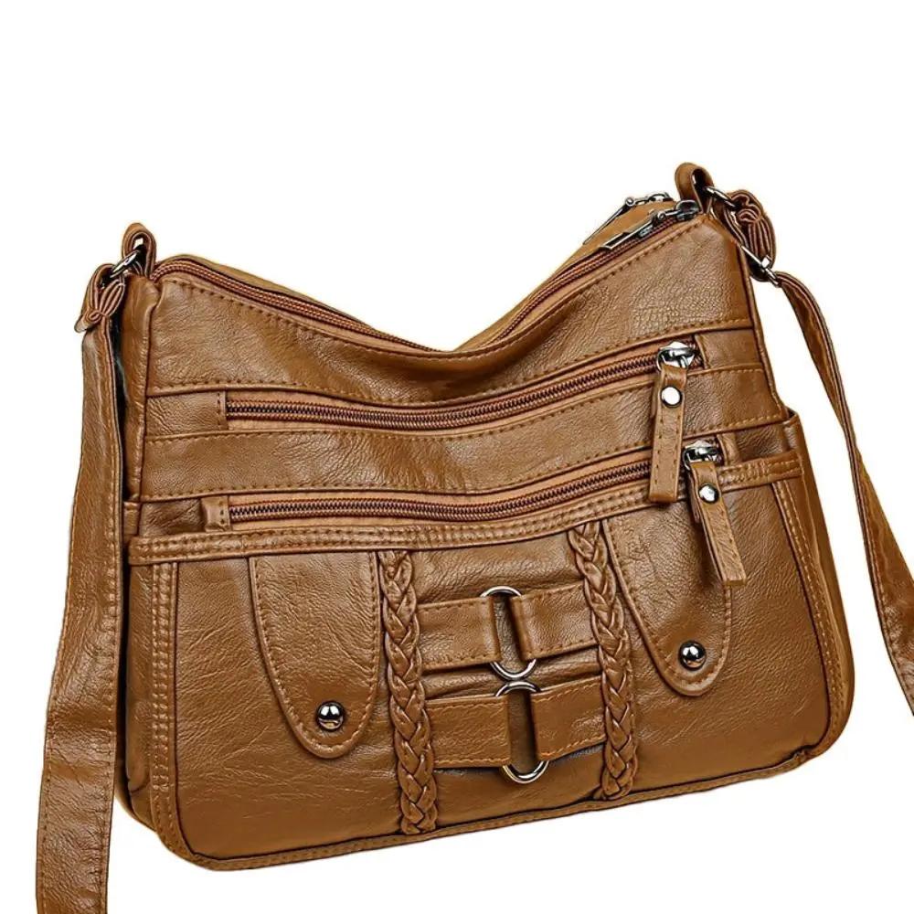 Sac bandoulière sécurisé Ivy de Danoir Paris, en cuir noir avec poche intérieure et fermeture à glissière, vue de face.