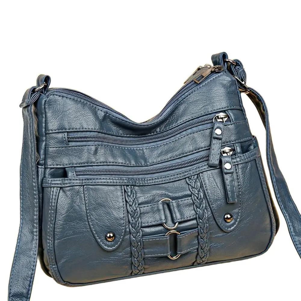 Sac bandoulière sécurisé Ivy de Danoir Paris, en cuir noir avec fermeture sécurisée et design élégant.