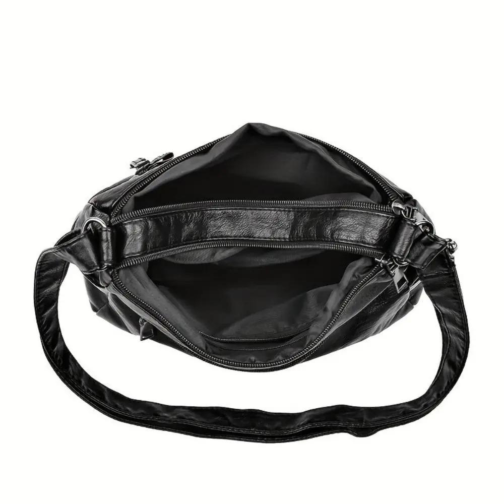 Sac bandoulière noir Danoir Paris Ivy, sécurisé avec compartiments visibles, design élégant et pratique pour un usage quotidien.