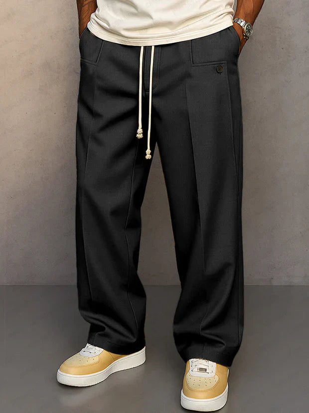Pantalon élégant noir Danoir Paris Didier avec cordon ajustable, vue de face, tissu fluide et style sophistiqué.
