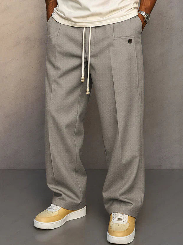 Pantalon élégant noir Danoir Paris Didier avec cordon ajustable, tissu fluide et coupe moderne, porté par un mannequin.