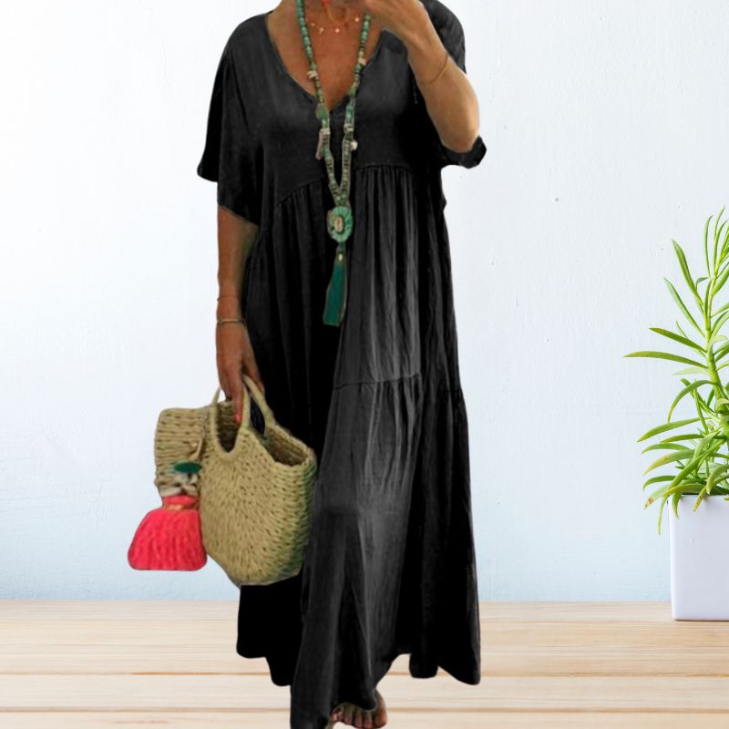 Robe fluide élégante Andrea de Danoir Paris, en tissu noir avec coupe sophistiquée et détails modernes.