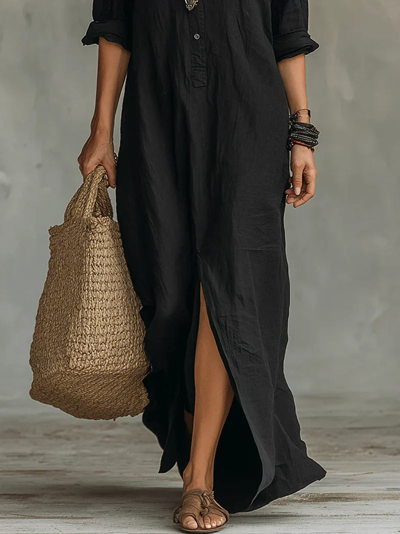 Robe maxi noire ample Céline™ avec boutons, vue de face, élégante et fluide, par Danoir Paris.