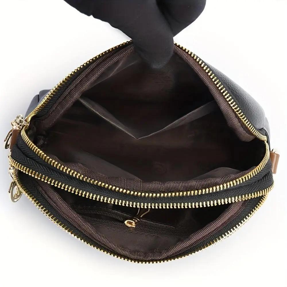 Sac bandoulière Sienna de Danoir Paris, en noir, avec design confortable et élégant, idéal pour un style pratique et moderne.