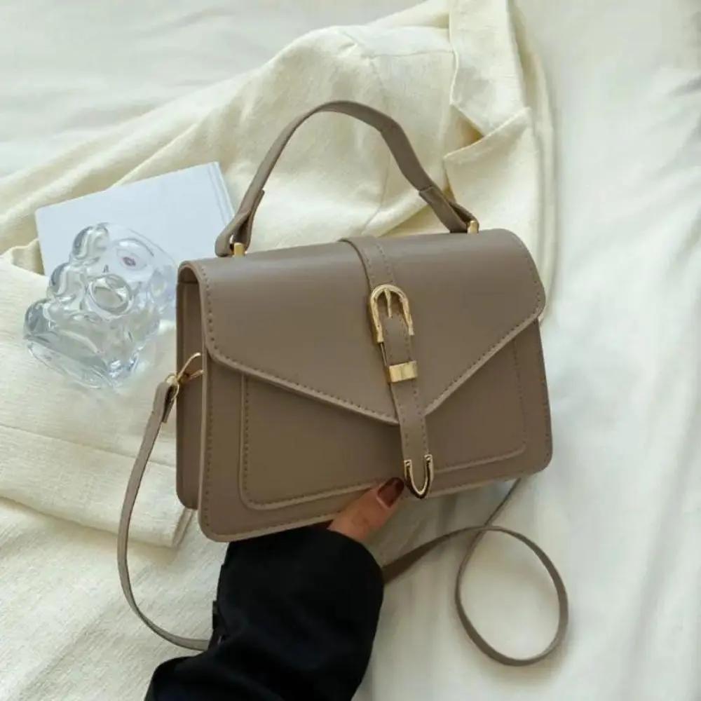 Sac à bandoulière noir Danoir Paris Tessa, sac élégant et minimaliste en cuir avec bandoulière ajustable.