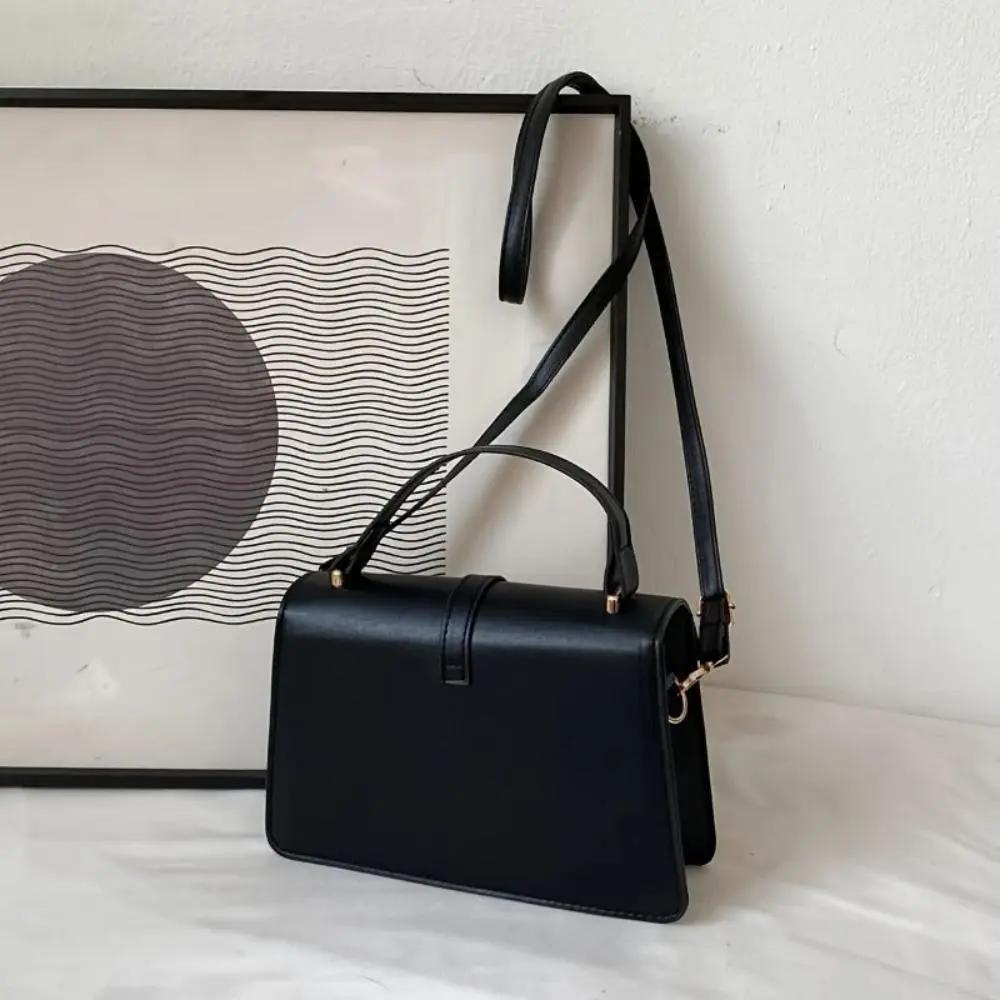 Sac à bandoulière noir Danoir Paris Tessa, sac élégant et minimaliste avec bandoulière en cuir naturel.