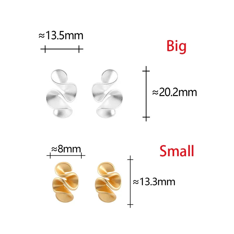 Boucles d'oreilles en argent et or 18K Danoir Paris, design élégant avec pendentifs en or jaune et argent brillant.