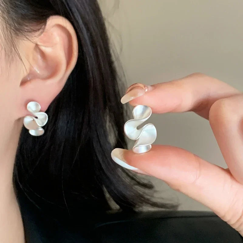 Boucles d'oreilles en argent et or 18K Danoir Paris avec design élégant et finition brillante.