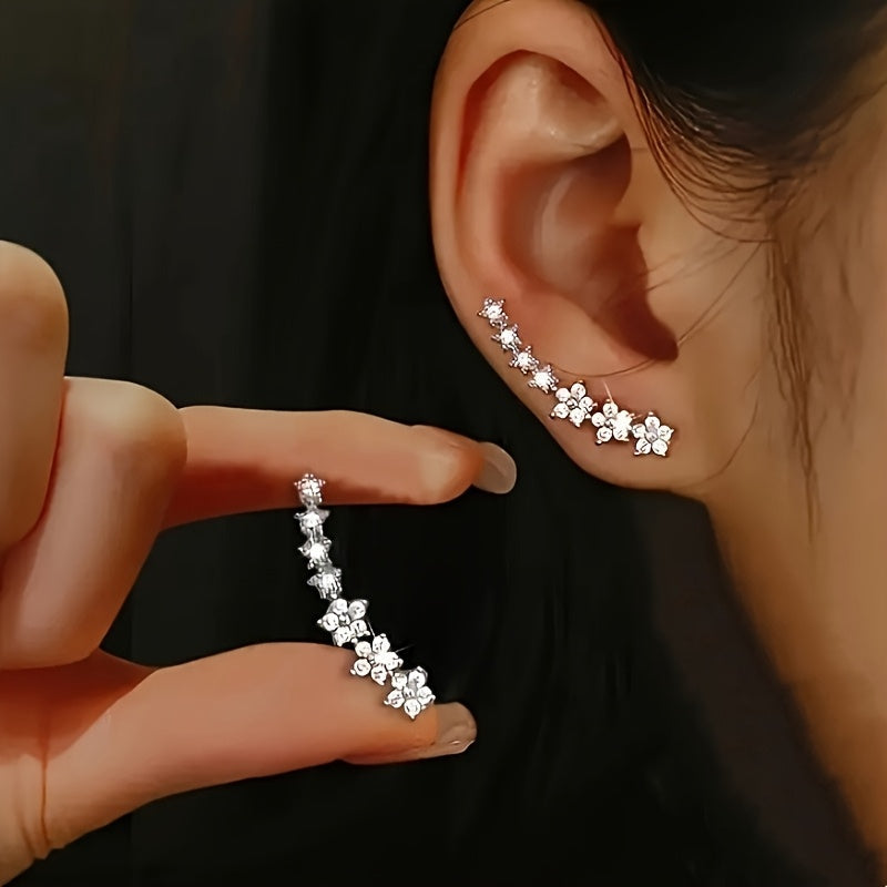 Boucles d'oreilles florales intemporelles Danoir Paris en or rose, avec motifs délicats et élégants.