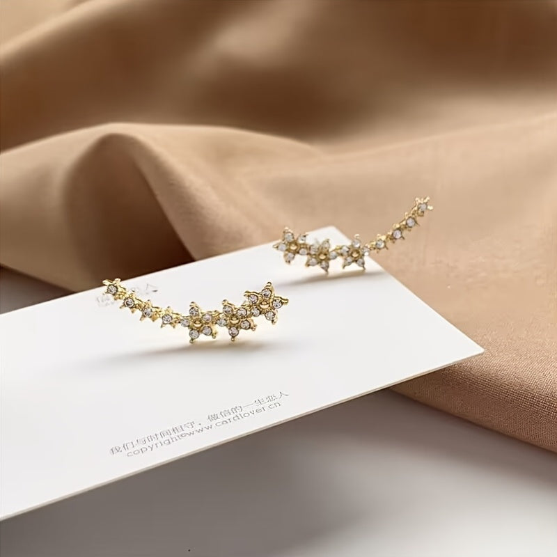 Boucles d'oreilles florales intemporelles Danoir Paris avec motifs délicats en or et design élégant.