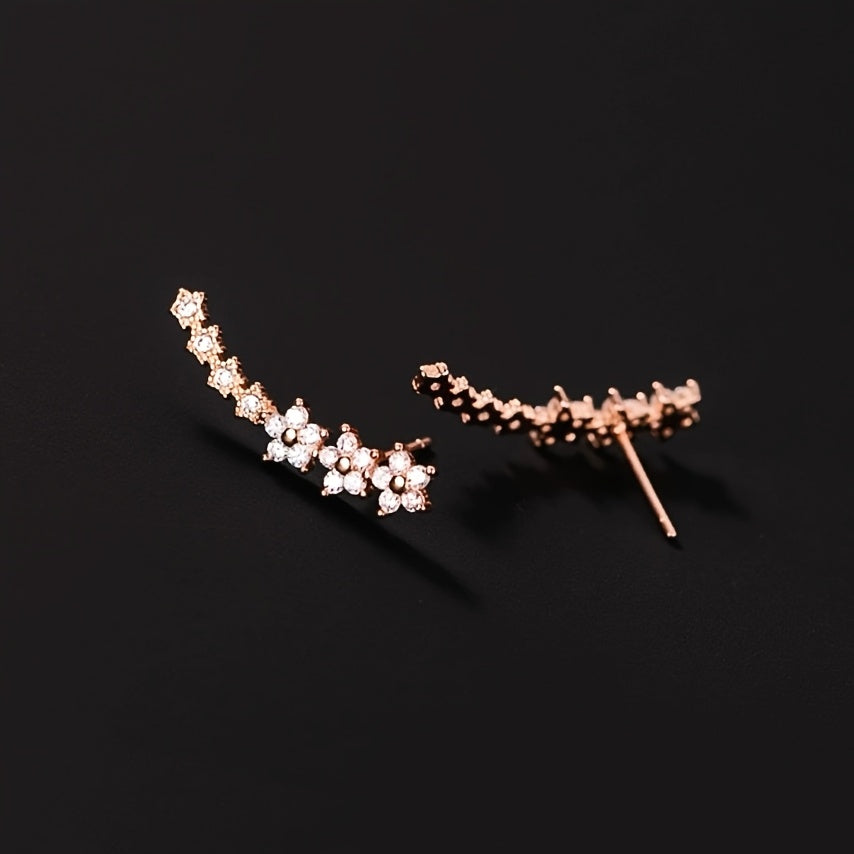 Boucles d'oreilles florales intemporelles en or rose de Danoir Paris, avec motifs délicats et élégants.