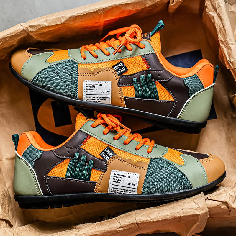Sneakers rétro colorées Giovanni de Danoir Paris en orange, design vintage avec semelle blanche et détails vibrants.