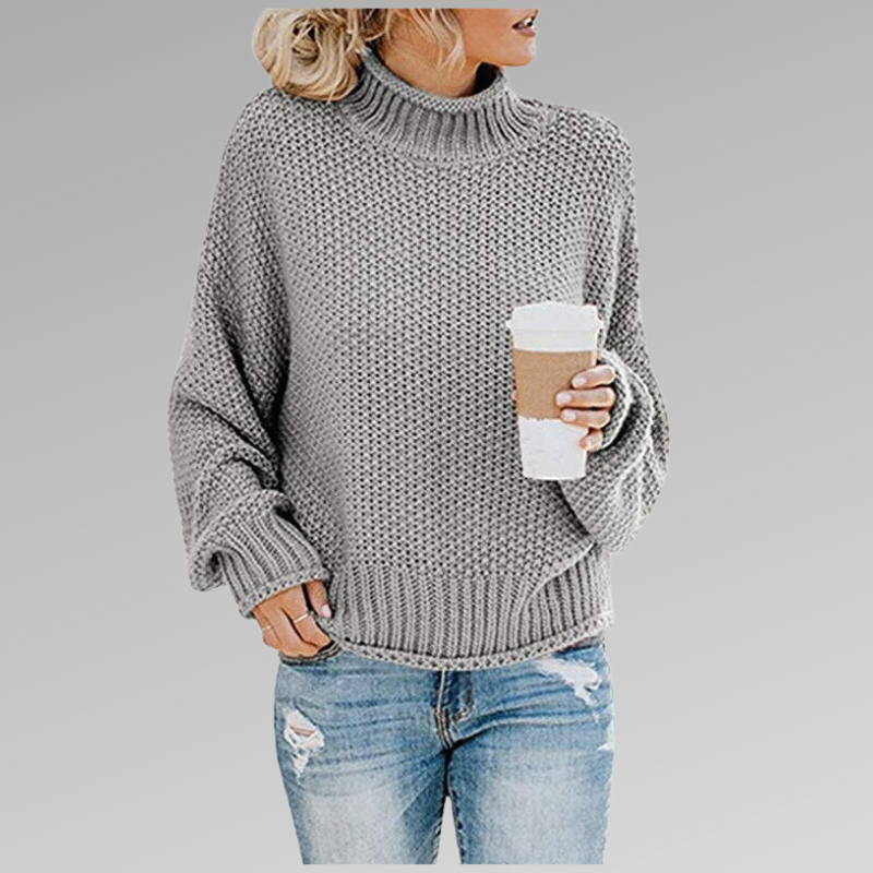 Pull décontracté et élégant Helena de Danoir Paris en orange, porté sur un mannequin, style chic et confortable.