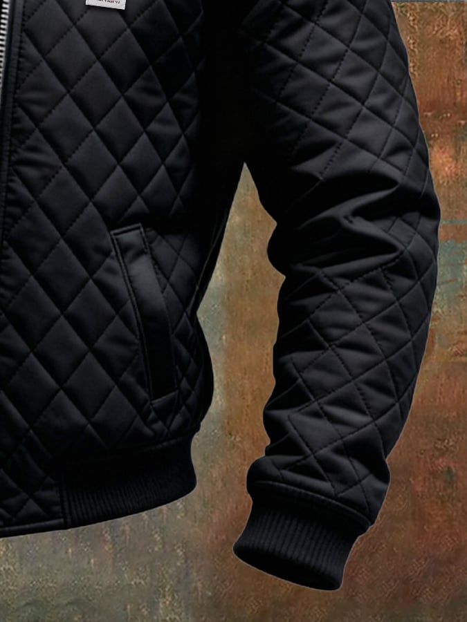 Veste matelassée noire Danoir Paris avec épaules en cuir, style élégant et moderne, vue de face sur mannequin.