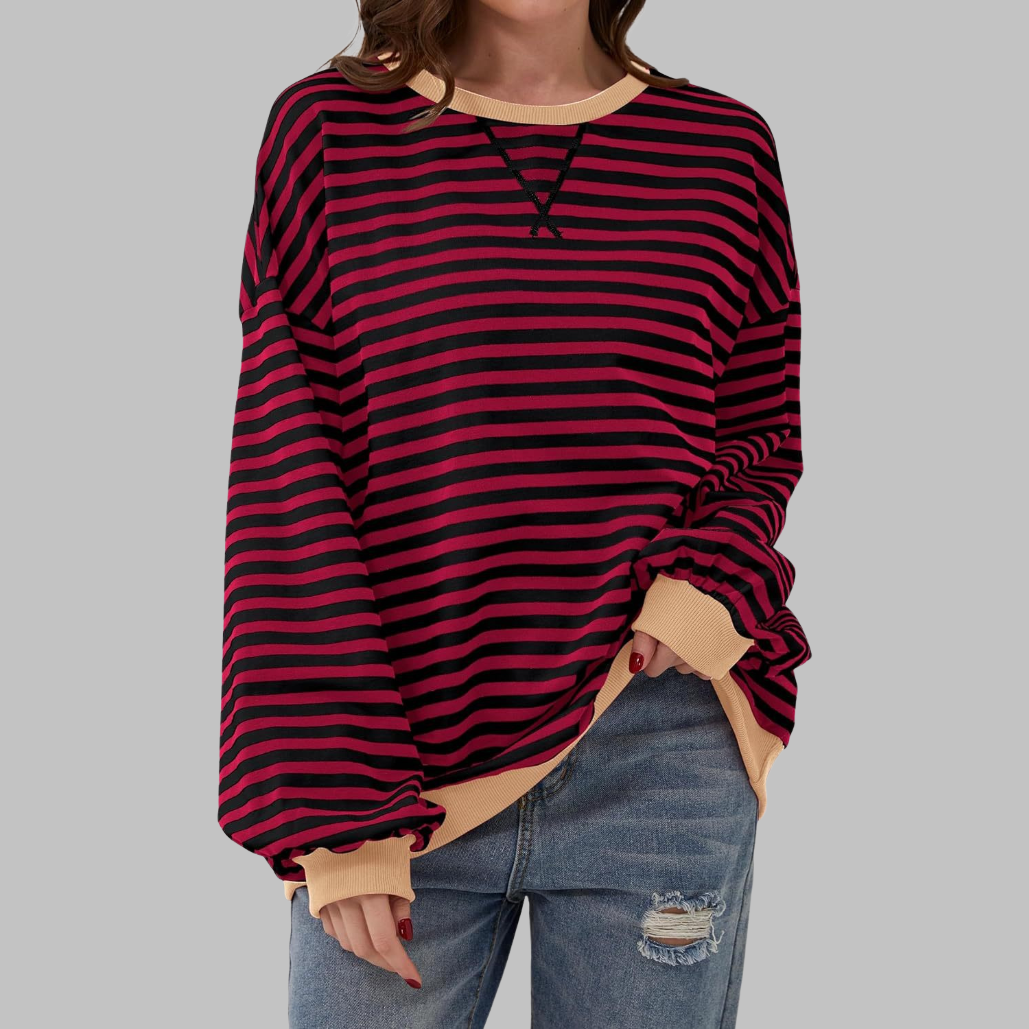 Sweatshirt à manches longues et col rond Danoir Paris, rayures roses, style décontracté, visible sur le produit.
