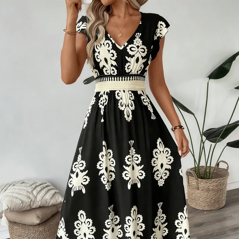 Robe maxi noire Danoir Paris Candela avec motif baroque et décolleté en V, vêtement élégant en tissu fluide.