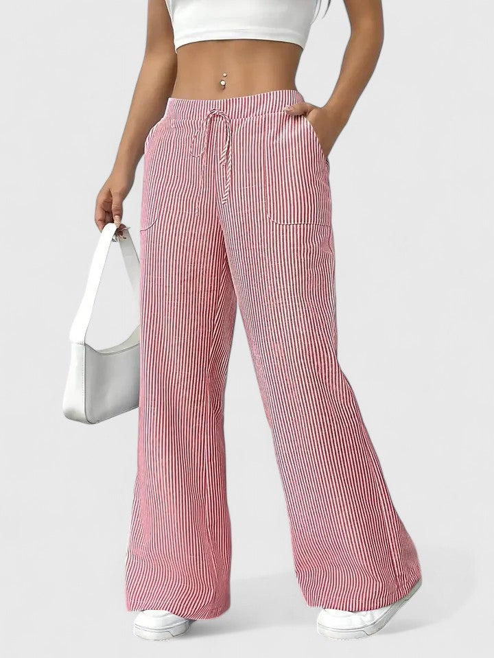 Pantalon large élégant Dominique de Danoir Paris, en tissu fluide rose, vue de face sur mannequin.