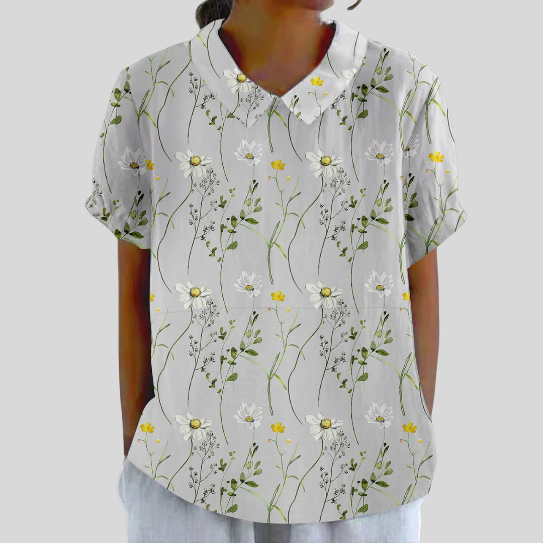 Blouse Aurore Danoir Paris avec motif marguerites sauvages, tissu léger et style élégant pour femme.