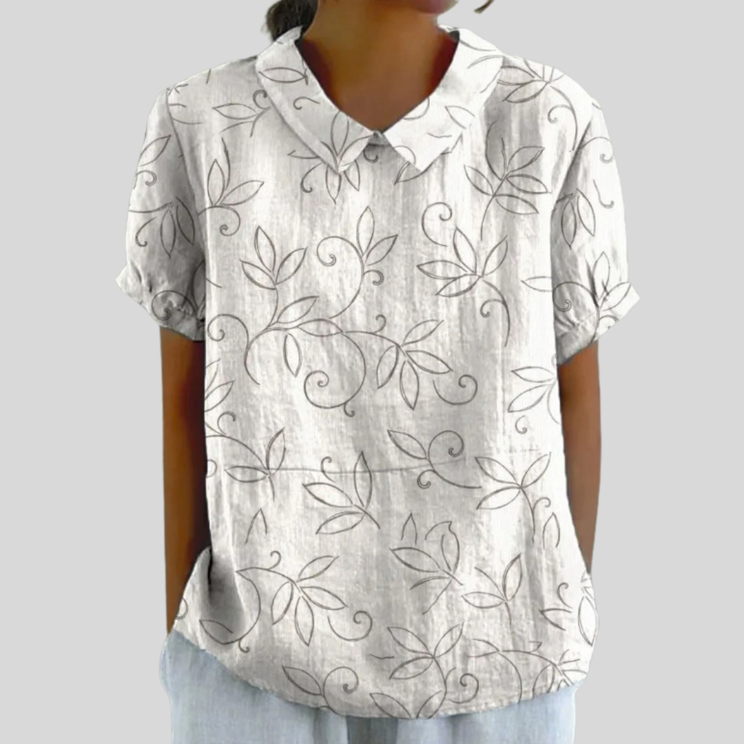 Blouse Édith minimaliste avec motif feuillage, en tissu léger, portée par un mannequin, de la marque Danoir Paris.