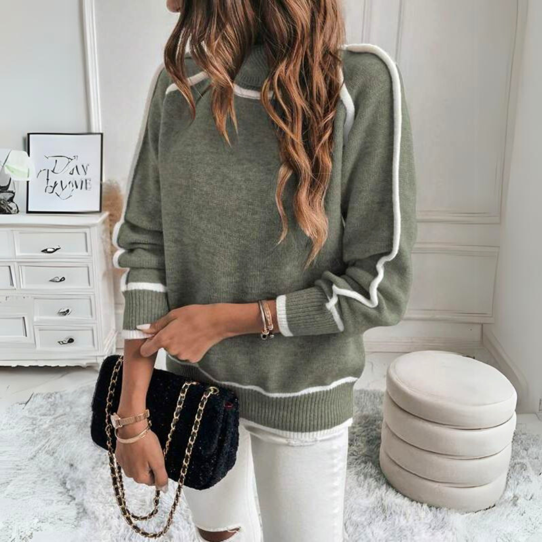 Pull roulé élégant Kaylee de Danoir Paris porté par un mannequin, en tissu doux et finition soignée, couleur neutre.