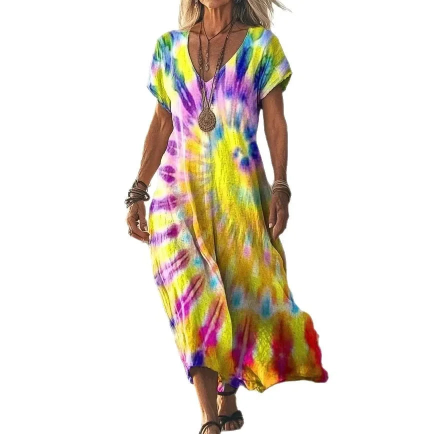 Robe longue Danoir Paris Isola à imprimés naturels, coupe aérienne et style tie-dye jaune, tissu léger et fluide.