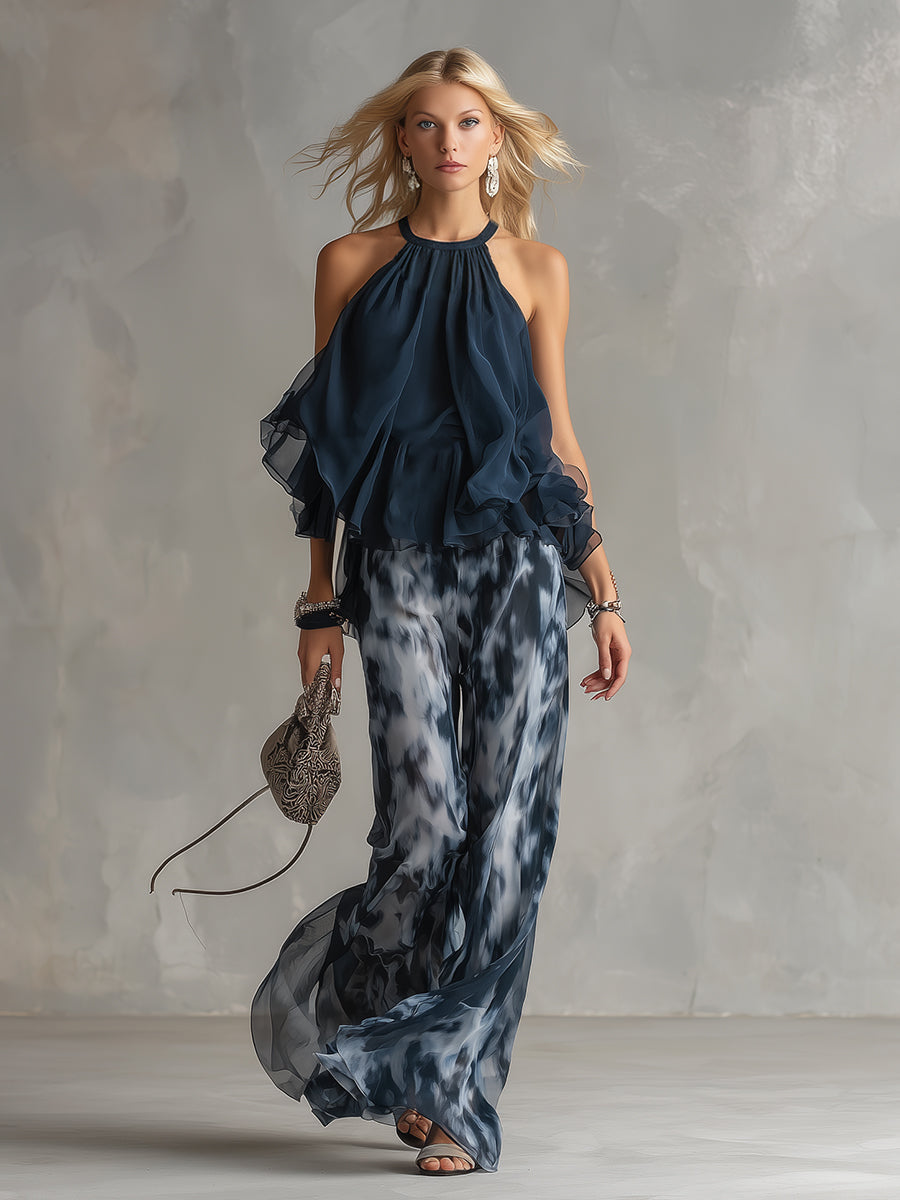 Ensemble Danoir Paris Elise, costume léger et élégant, haut fluide et pantalon large bleu marine, parfait pour un style sophistiqué.