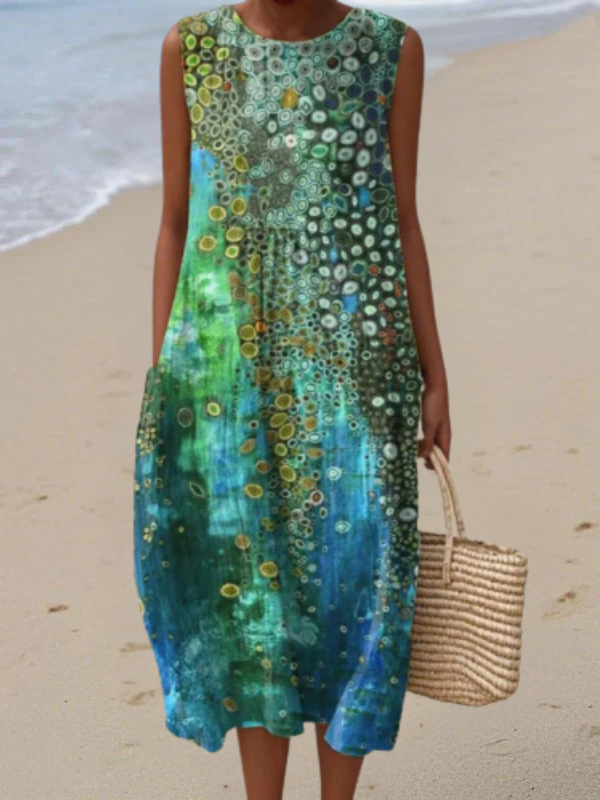 Robe midi sans manches de la marque Danoir Paris, style Zara Reef, en tissu multicolore, portée élégante et tendance.