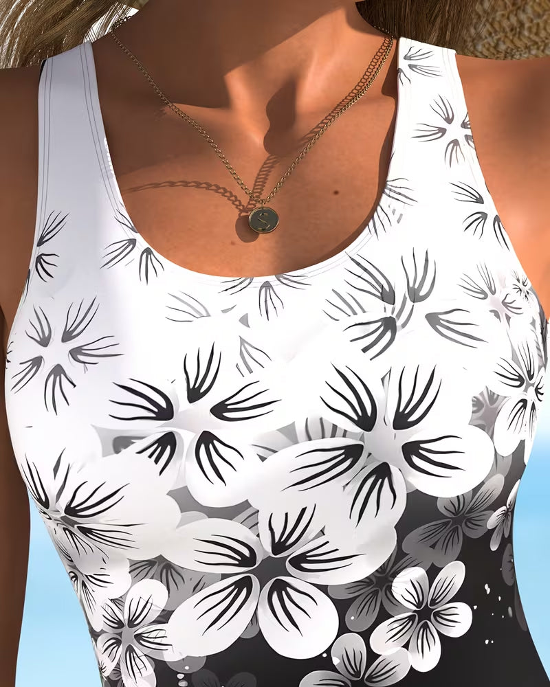 Maillot de bain une-pièce Danoir Paris à imprimé fleuri noir, avec design mode élégant et ajusté, pour femmes.
