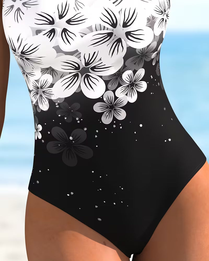 Maillot de bain une pièce Danoir Paris imprimé fleuri, en noir, avec un design mode élégant et confortable.