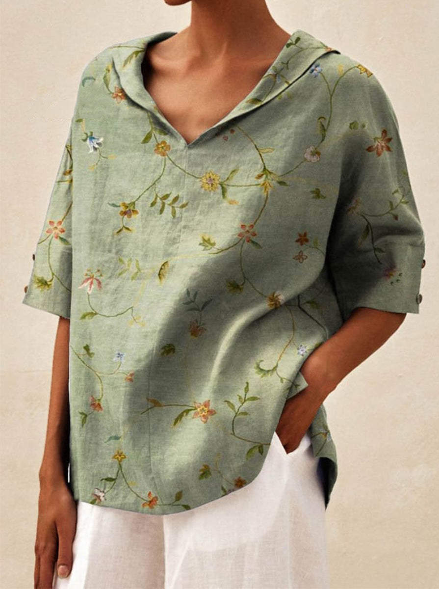 Haut léger floral estival Andrea de Danoir Paris, blouse blanche avec motif floral délicat, manches légères et coupe élégante.